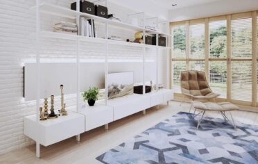 Salon w stylu skandynawskim z białym regalem w systemie Orto