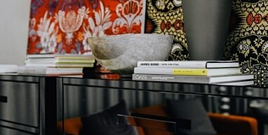 Kaboompics Books and decorations on a mirrored commode