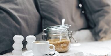 Kaboompics Morning coffee with a jar of brown sugar with pillows