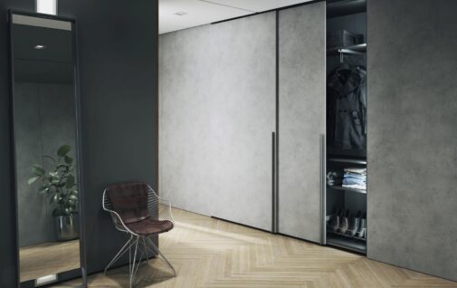 Nowoczesny przedpokoj z szafa przesuwna w dekorze betonu