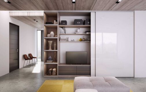 Otwarty salon z biala szafa przesuwna skrywajaca telewizor
